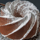 a vanilla bundt cake sprinkled with powdered sugar